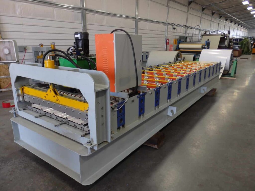Metal roll-forming machine on a factory floor